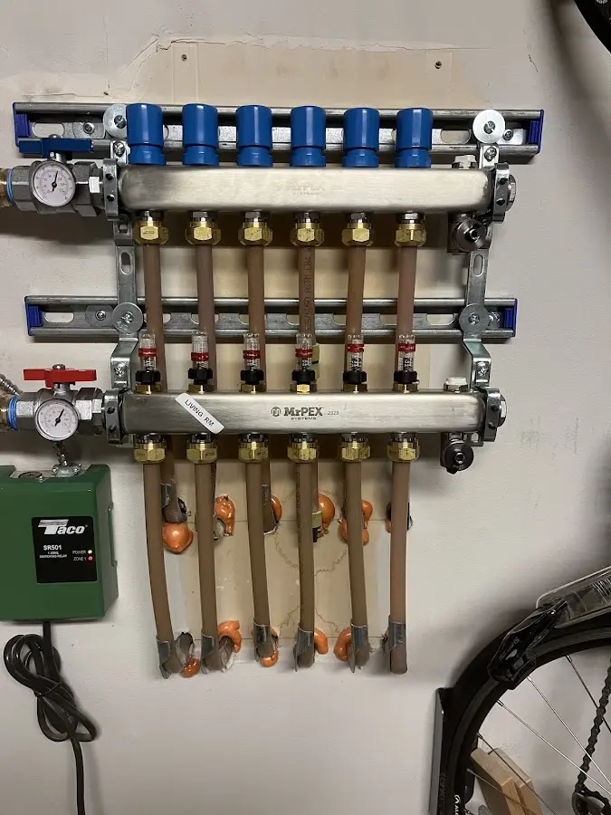 Plumber performing Water Heater Repair at a residential property in Taylor